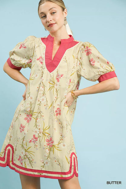 Umgee floral puff sleeve dress with contrast trim, featuring a feminine silhouette and vibrant floral pattern.