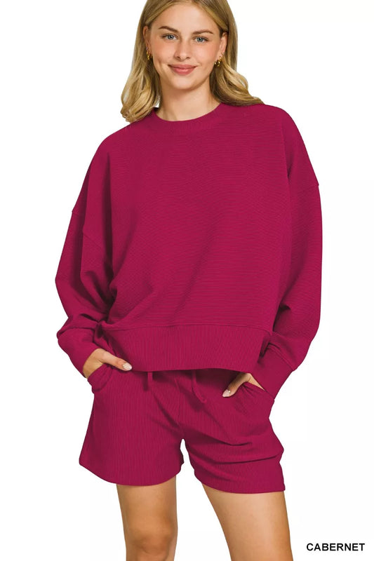 Zenana ribbed round neck pullover and shorts set in Cabernet, casual loungewear from Trendsi with cozy knit fabric.