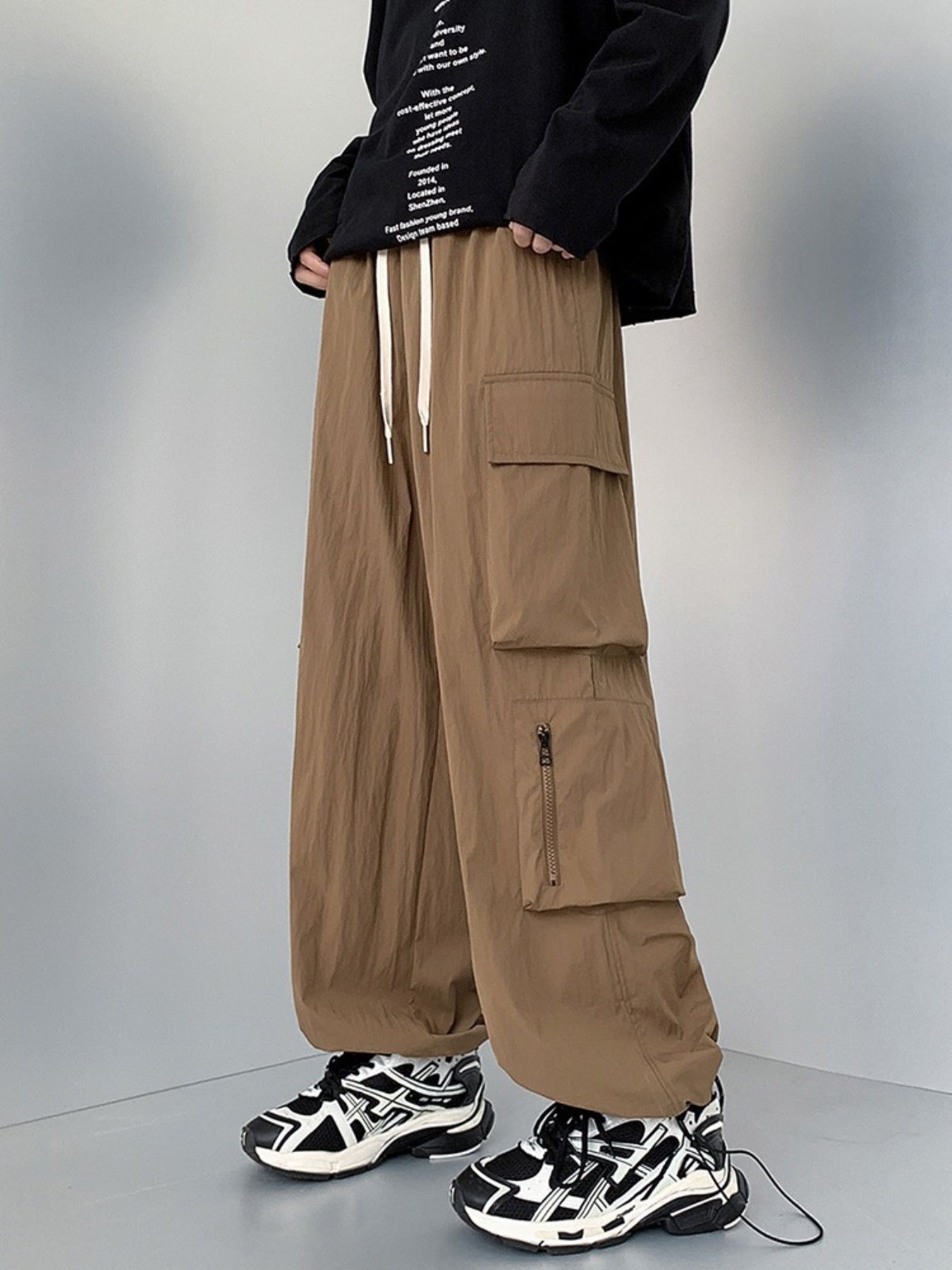Men's plus size loose fit cargo pants with drawstring in camel color, casual style, made by Trendsi.