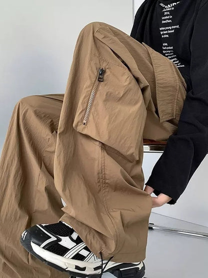 Men's plus size loose fit cargo pants with drawstring in camel color from Trendsi, featuring multiple pockets and comfortable fit.