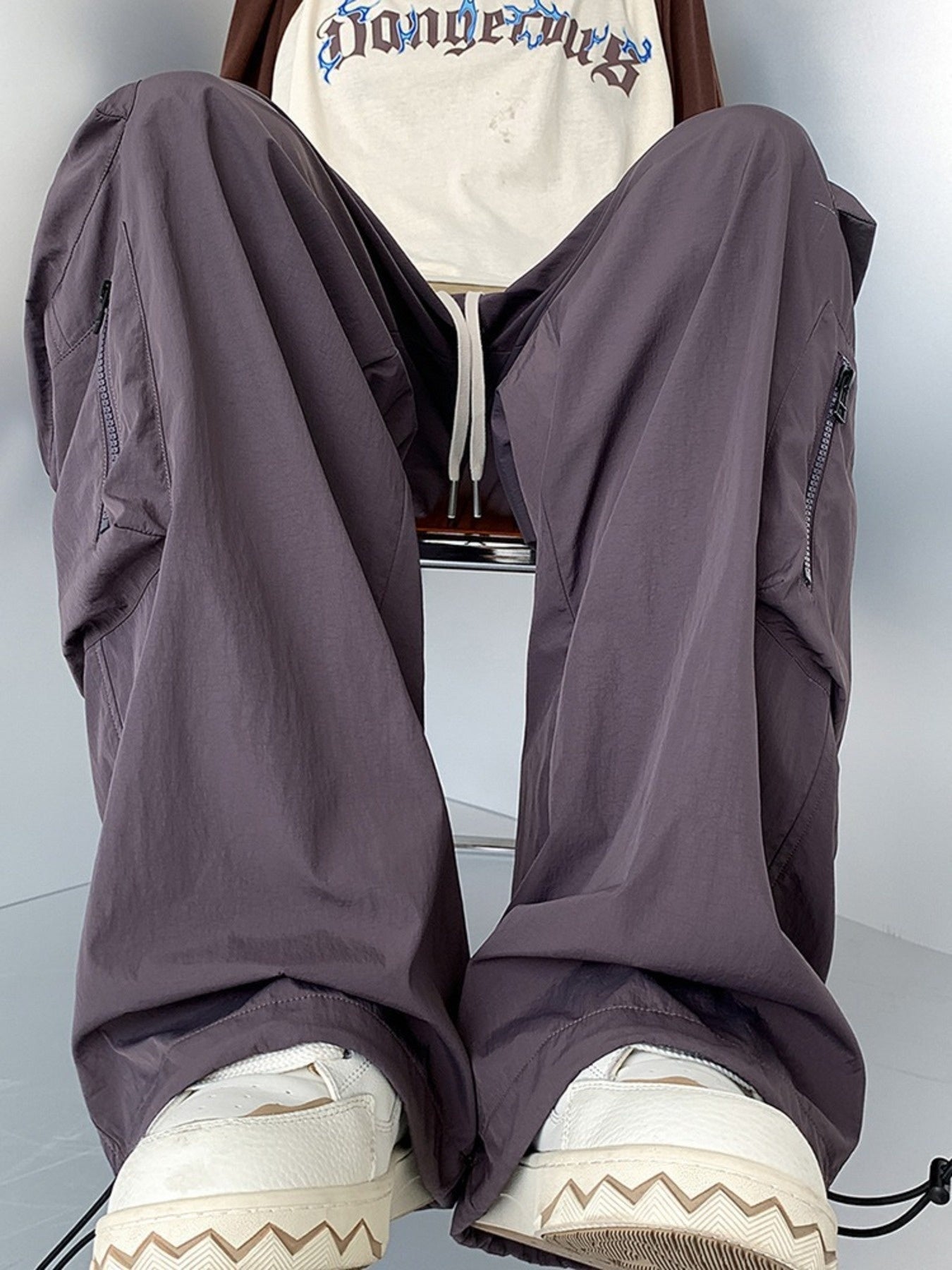 Men's plus size loose fit cargo pants with drawstring in camel color from Trendsi, shown with relaxed fit and functional pockets.