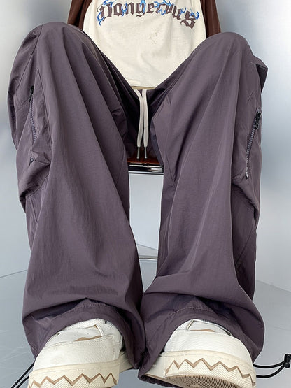 Men's plus size loose fit cargo pants with drawstring in camel color from Trendsi, shown with relaxed fit and functional pockets.
