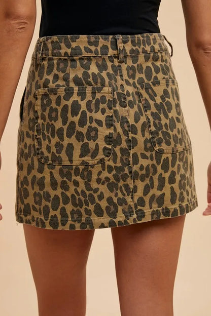 Leopard denim mini skirt from Annie Wear by Trendsi featuring a stylish short fit and leopard print pattern.
