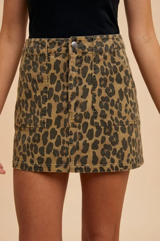Leopard print denim mini skirt by Annie Wear featuring a trendy leopard pattern, fitted silhouette, and classic denim texture.