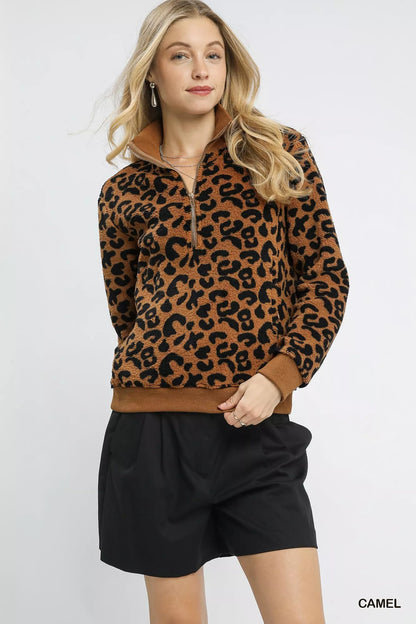 Camel leopard print Umgee quarter-zip sweatshirt with ribbed cuffs and collar, styled for casual wear.