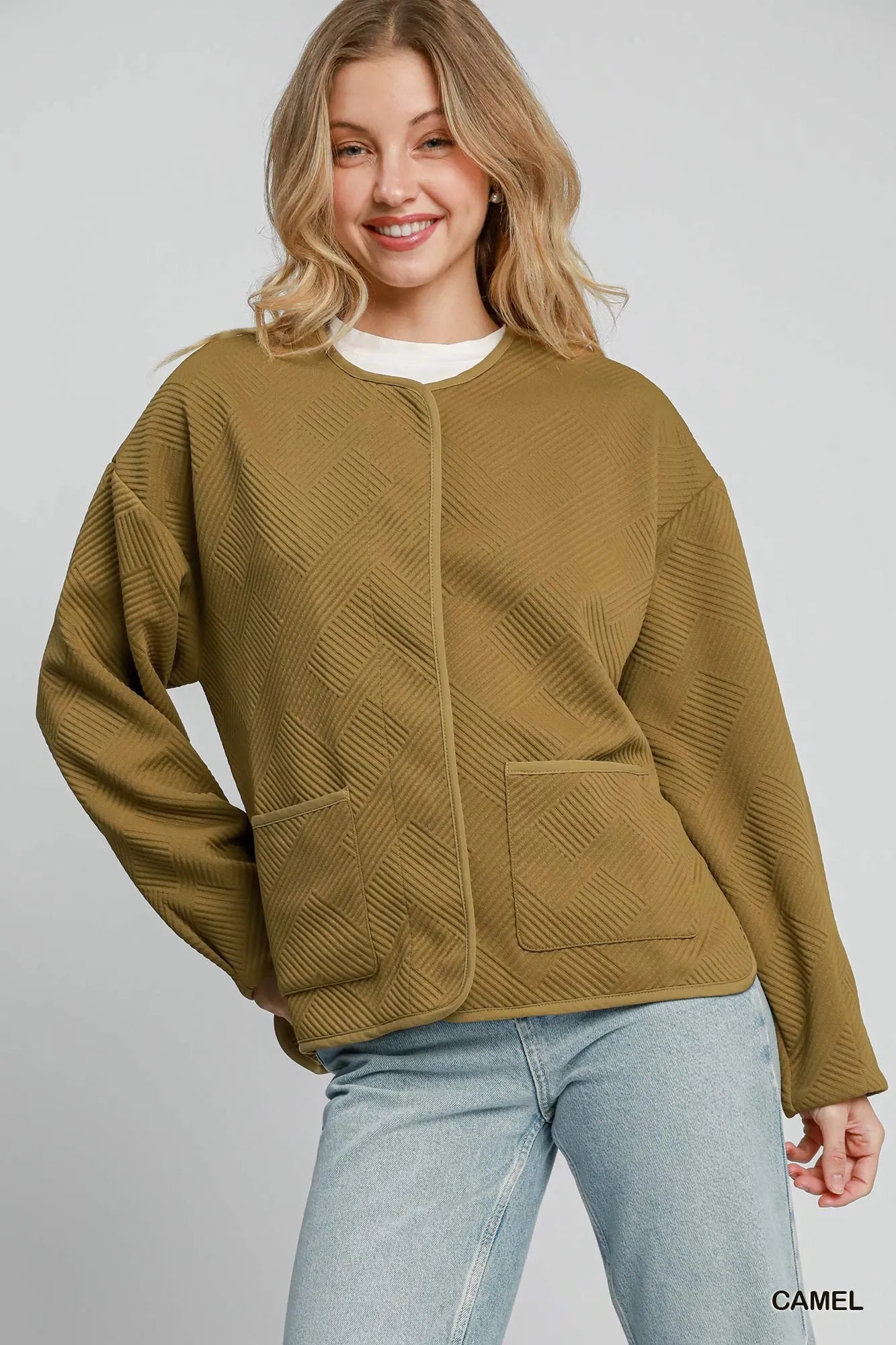 Camel Umgee textured jacquard jacket with long sleeves and open front, stylishly displayed on a hanger.