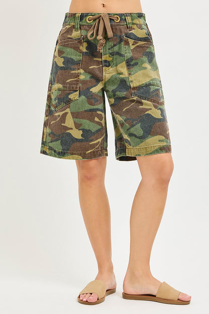 Risen camo print slouchy jorts with eyelet drawstring and relaxed fit, casual denim shorts for a trendy streetwear look.