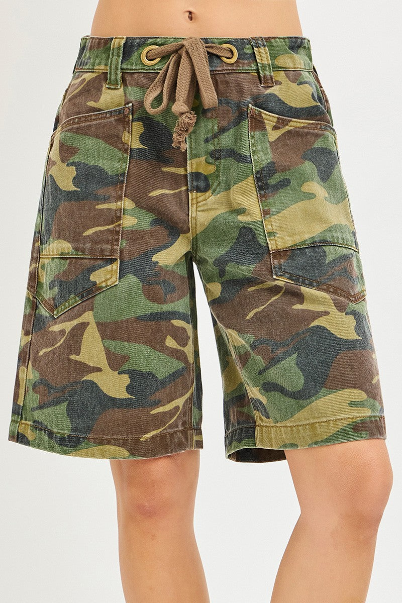 Risen camo print slouchy jorts with eyelet drawstring and relaxed fit, casual denim shorts in camouflage pattern.