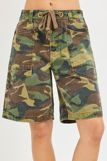 Risen camo print slouchy jorts with eyelet drawstring and relaxed fit, casual denim shorts in camouflage pattern.
