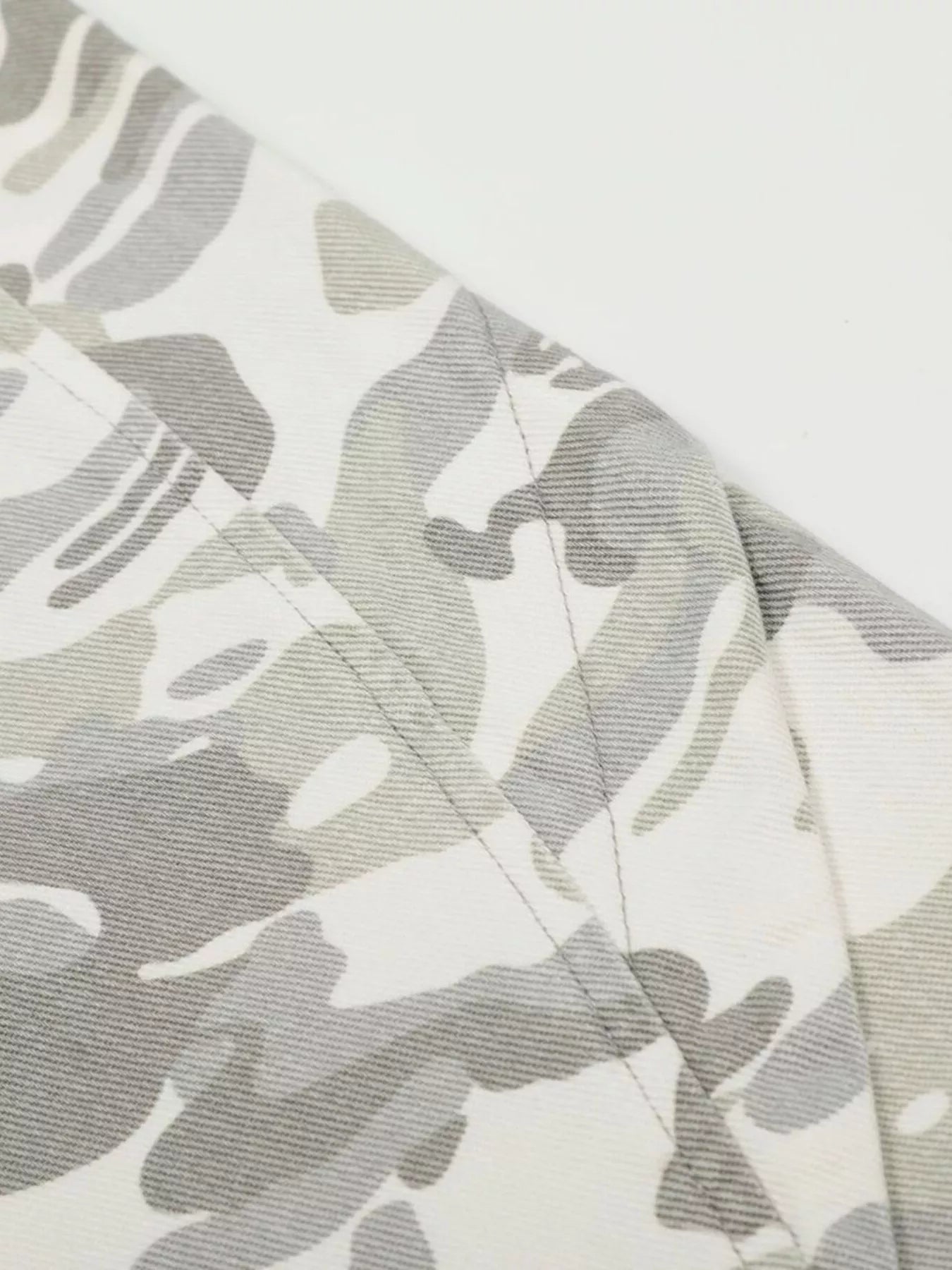 Men's camouflage wide-leg cargo pants by Trendsi, featuring a green and brown camouflage pattern and multiple side and back pockets.