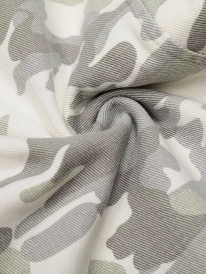Men's camouflage wide-leg cargo pants from Trendsi, featuring a relaxed fit and multiple pockets in a green and brown camouflage pattern.