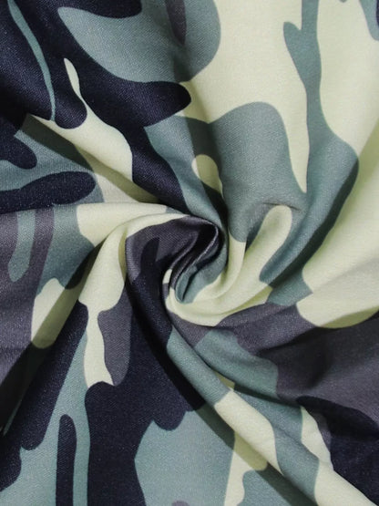 Camouflage button-front tie waist romper by Trendsi, featuring a stylish camo print, short sleeves, and a relaxed fit.