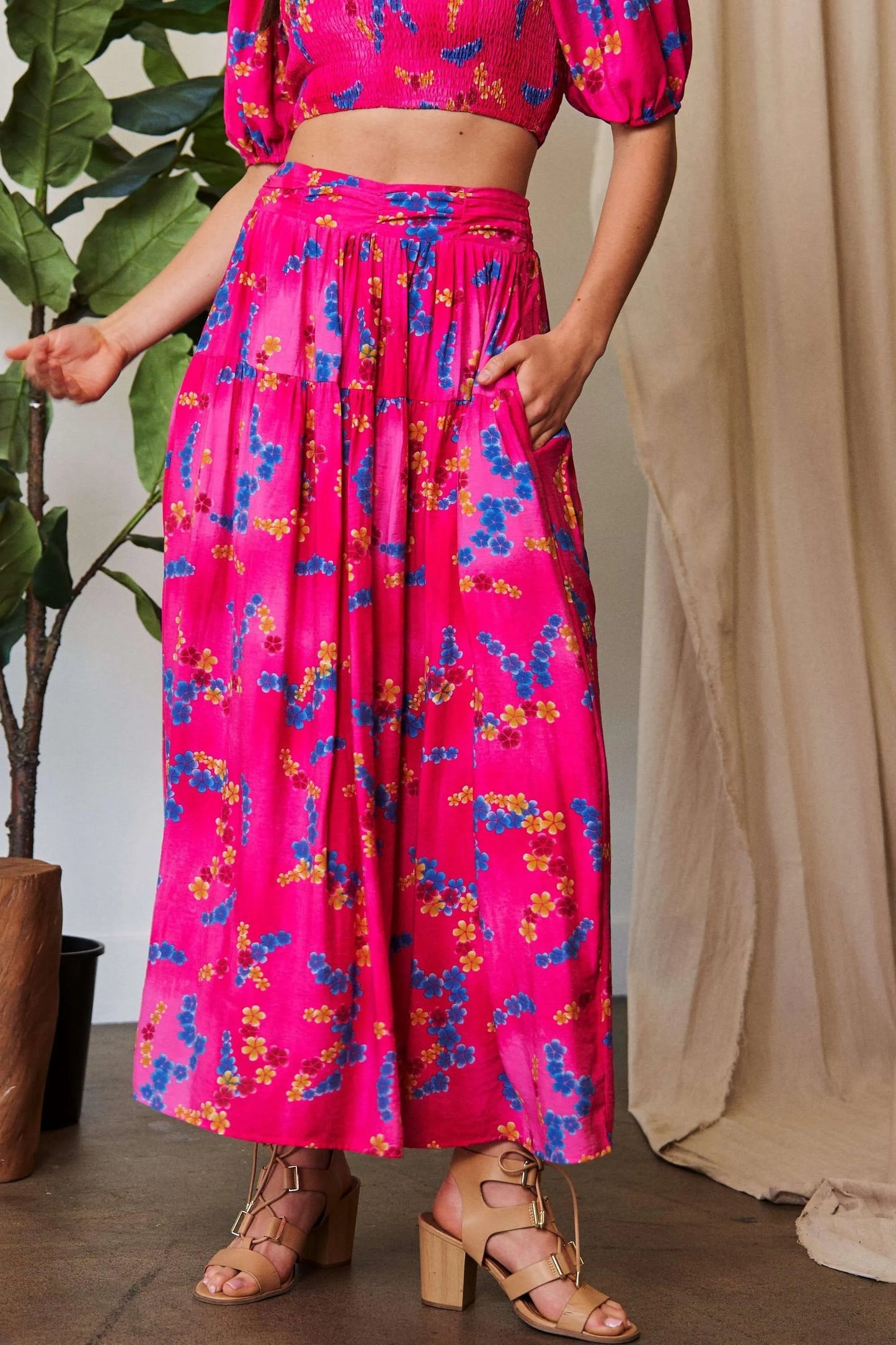 Candy pink Davi & Dani printed ruffled maxi skirt with smocking waistband, flowing and stylish for a feminine look.