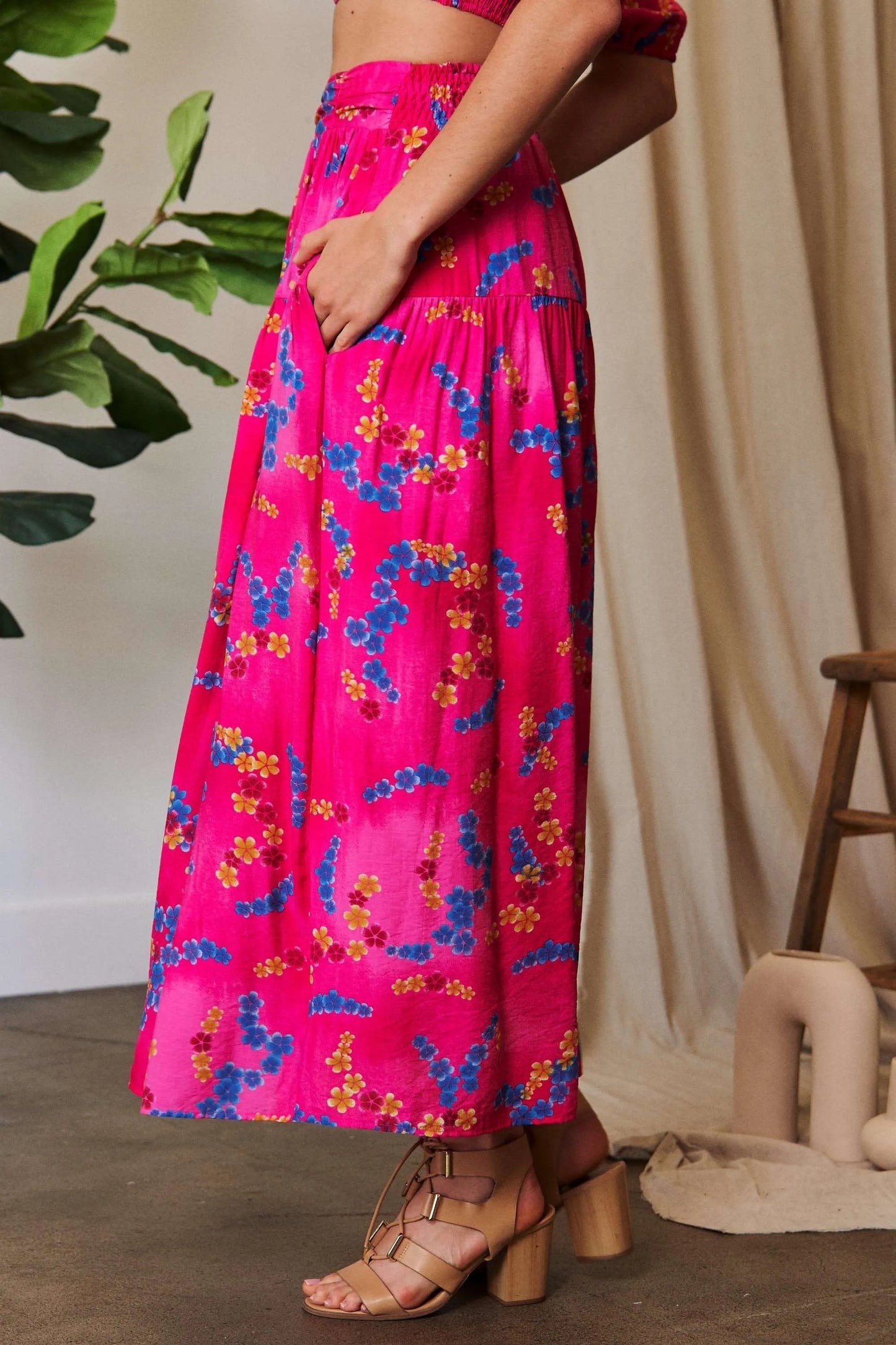 Candy pink Davi & Dani printed maxi skirt with smocking waistband and ruffled hem, stylish and flowy for casual or dressy wear