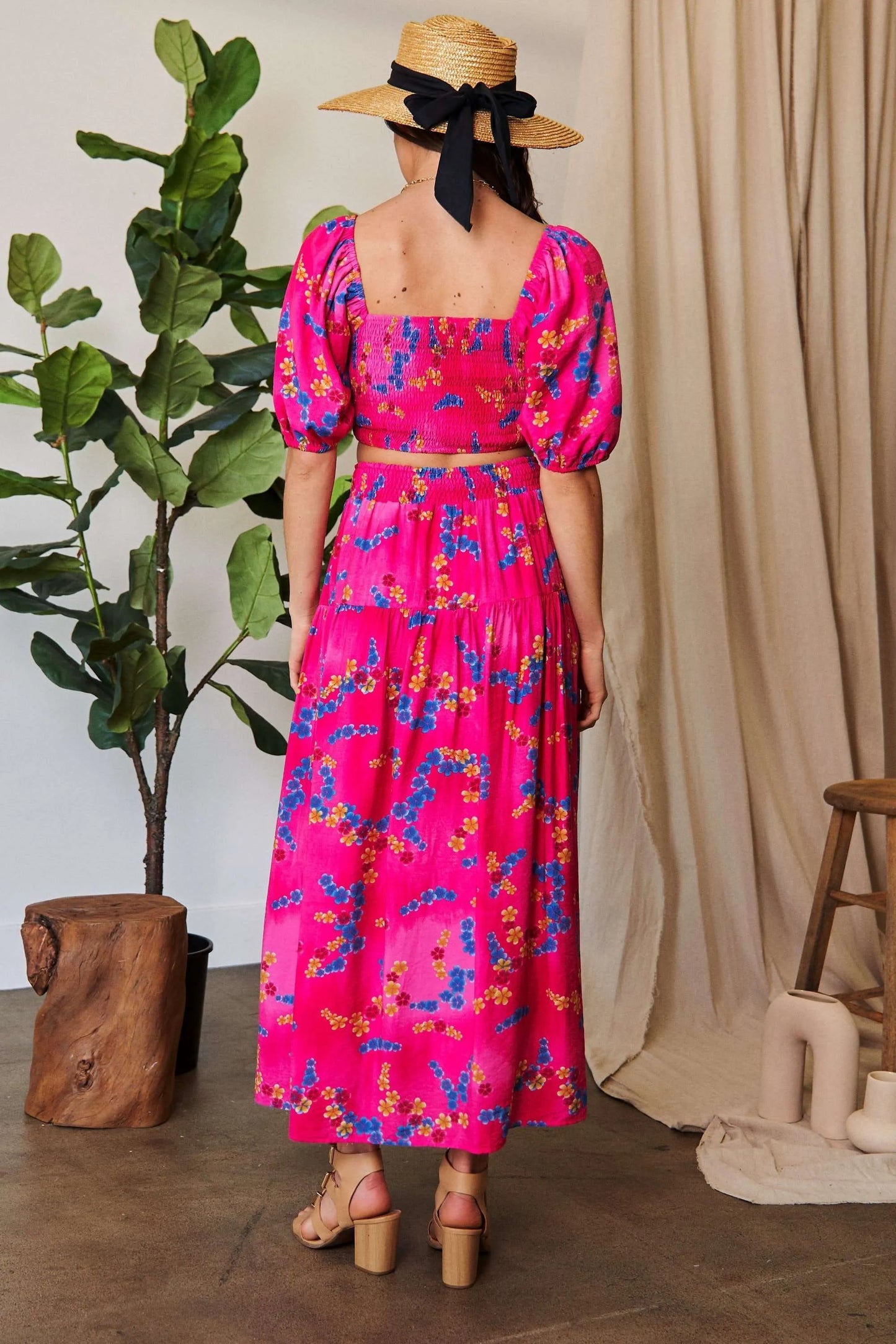 Candy pink Davi & Dani printed ruffled maxi skirt with smocking waistband, flowing and lightweight for breezy summer style.
