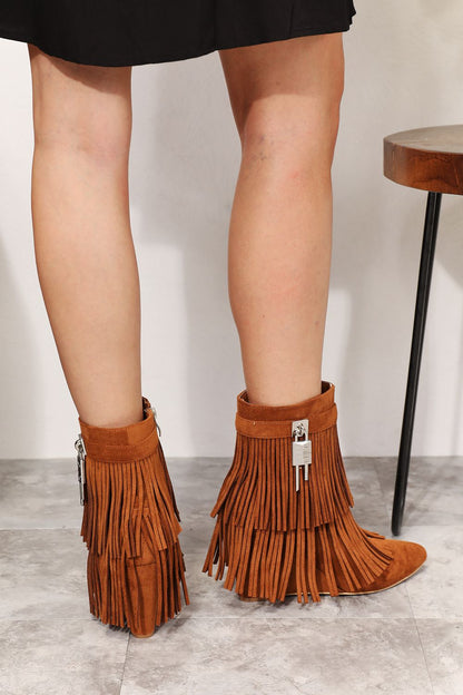 Caramel Legend women's tassel wedge heel ankle booties with stylish ankle-high design and tassel accents.