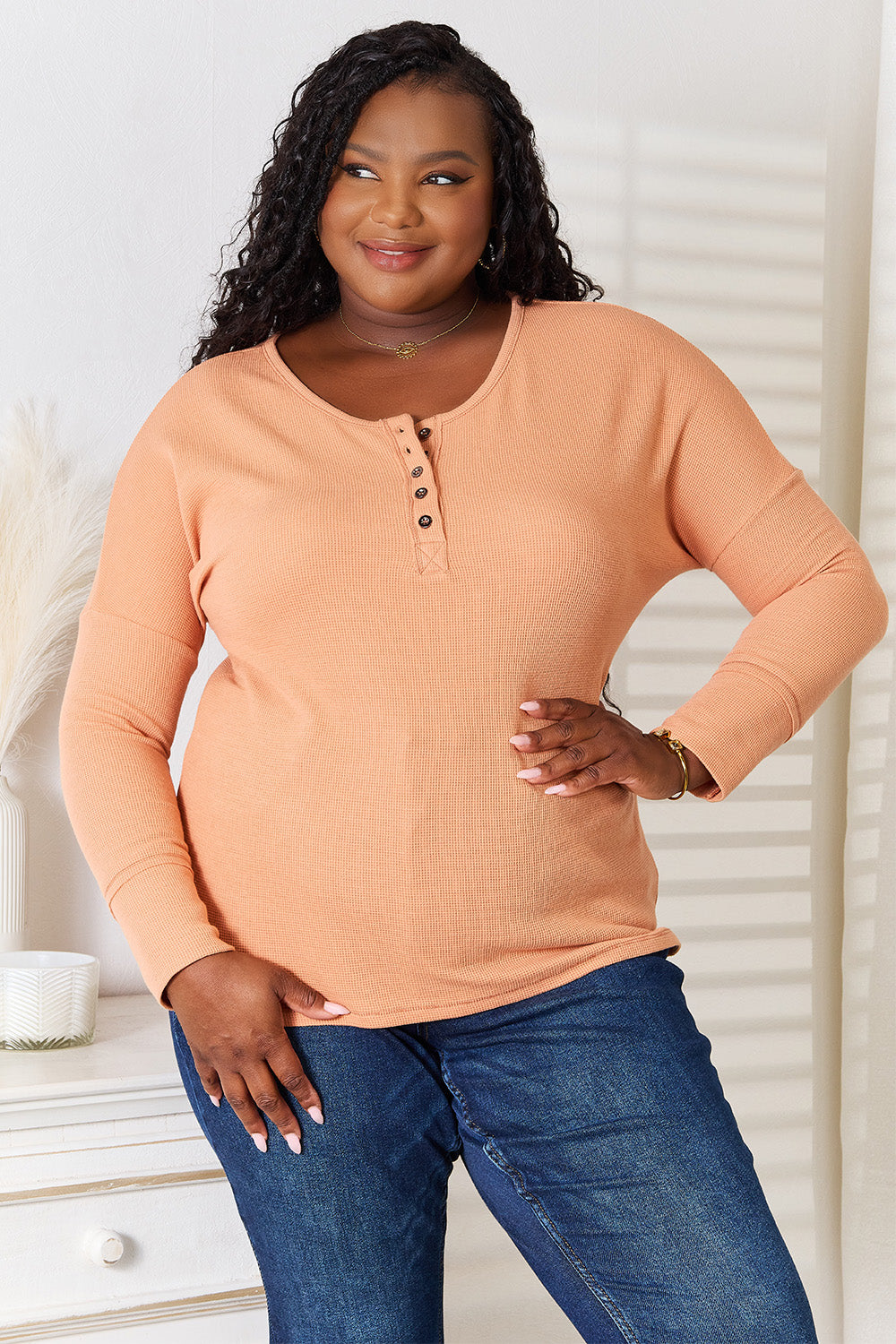 Caramel-colored Basic Bae half-button long sleeve top by Trendsi, featuring a relaxed fit and classic collar detail.