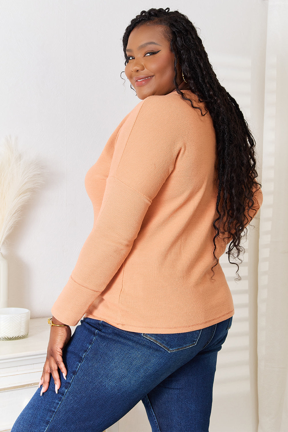Caramel-colored Basic Bae half-button long sleeve top by Trendsi, featuring a relaxed fit and classic collar design.