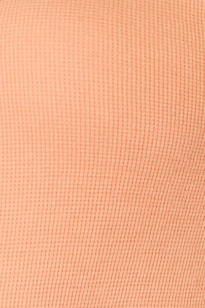 Caramel-colored Basic Bae half-button long sleeve top by Trendsi, featuring a relaxed fit and classic design.