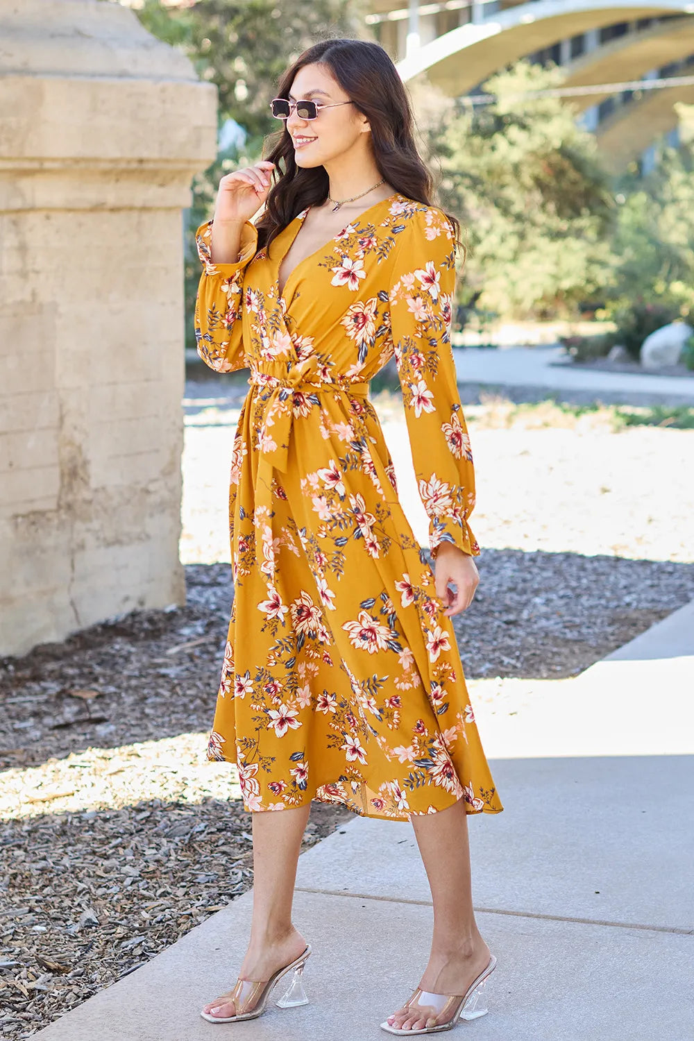 Caramel floral tie-back flounce sleeve dress by Trendsi, featuring a full-size fit and elegant design with a tie-back detail.