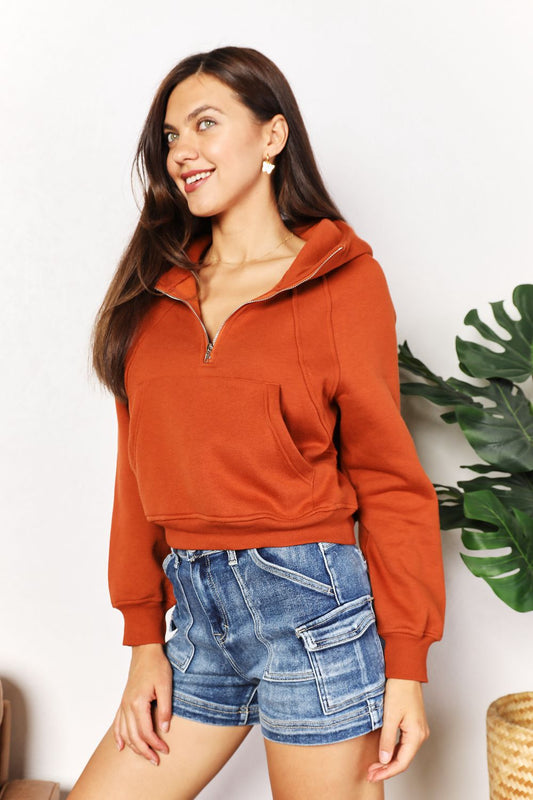 Caramel-colored Trendsi Double Take half-zip long sleeve hoodie with a relaxed fit and casual style.