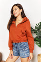 Caramel-colored Trendsi Double Take half-zip long sleeve hoodie with a relaxed fit and casual style.