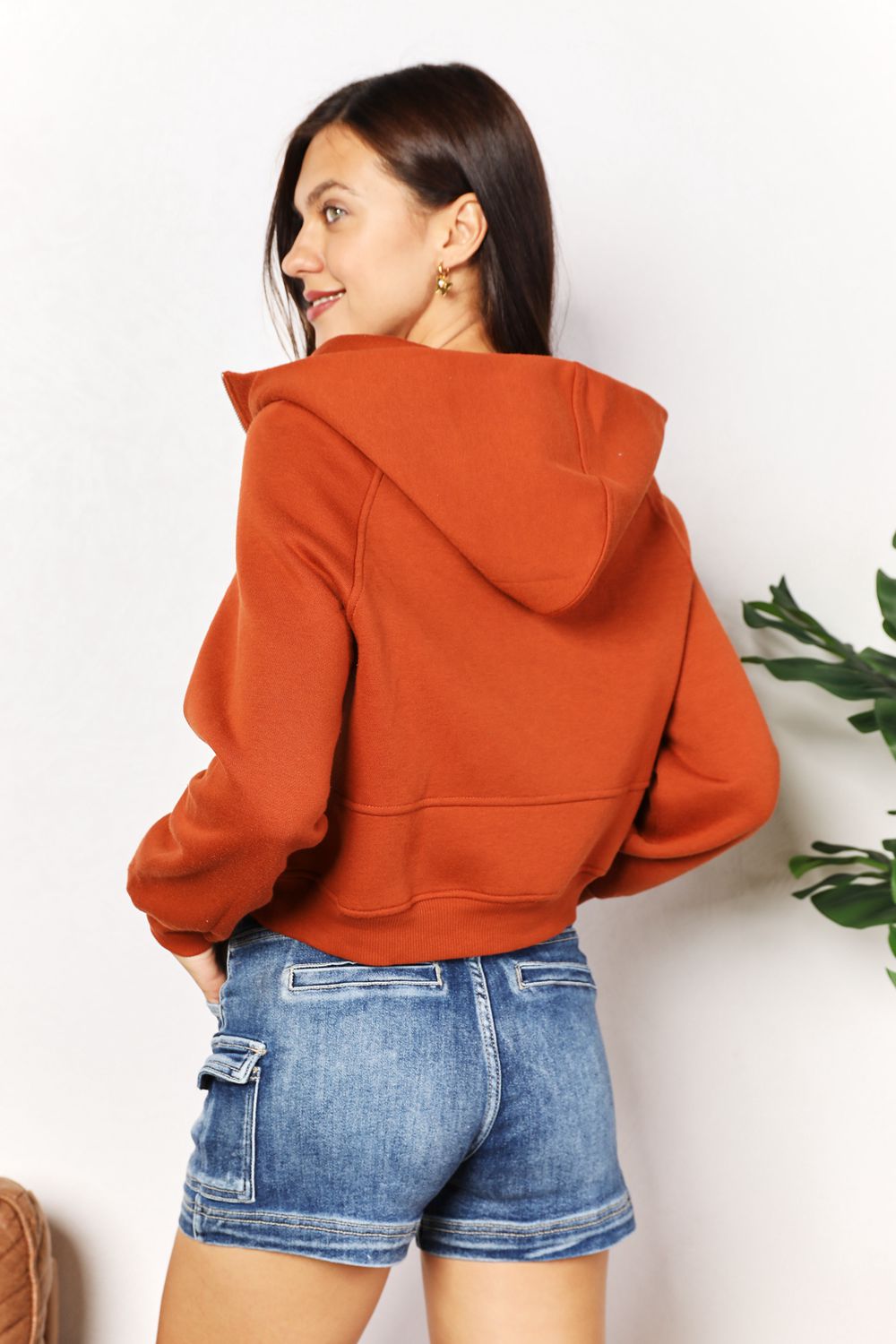 Caramel Trendsi Double Take half-zip long sleeve hoodie with a relaxed fit and comfortable fabric, featuring a stand collar and zipper detail.