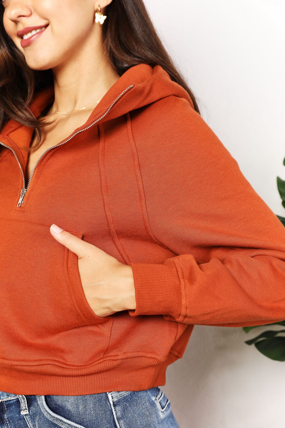 Caramel-colored Trendsi Double Take half-zip long sleeve hoodie with a relaxed fit and ribbed cuffs.