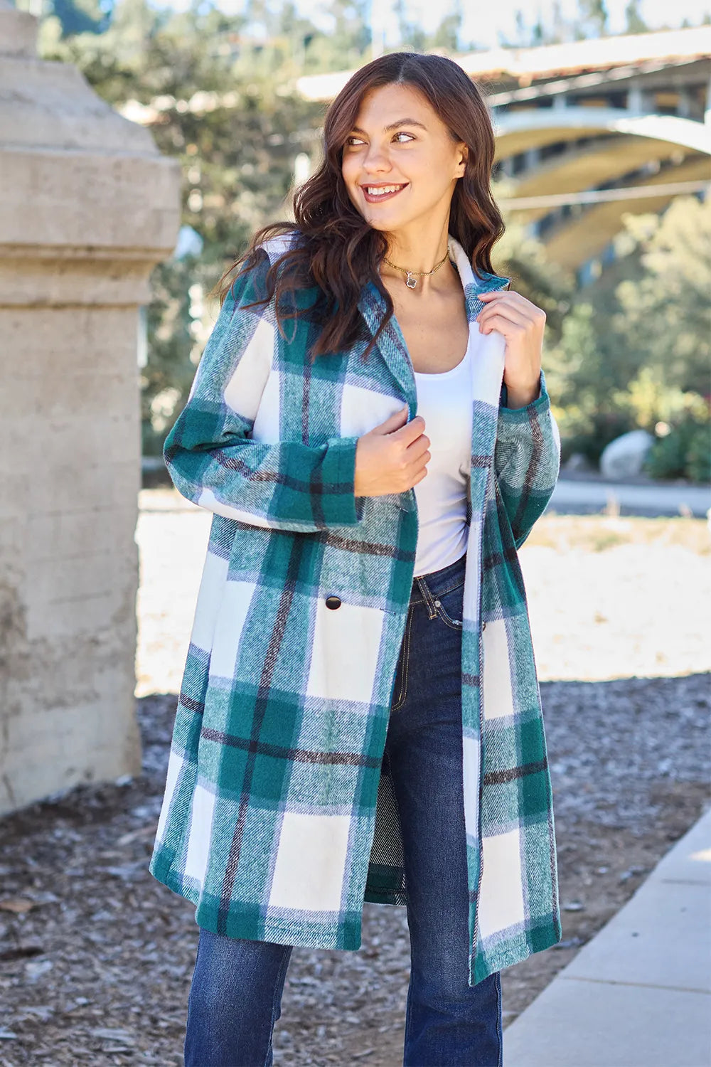 Pink plaid button-up coat with lapel collar, full size, from Trendsi Double Take collection, shown on a hanger.