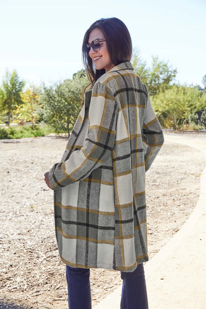 Pink plaid button-up coat with lapel collar from Trendsi, featuring a full-size design and classic checkered pattern.