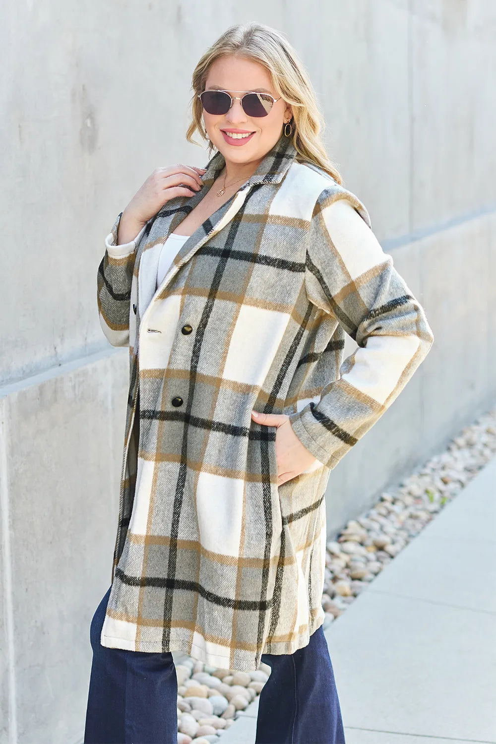 Pink plaid button-up coat with lapel collar, full size, by Trendsi, featuring double-breasted design and stylish lapel details.