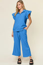 Cerulean blue Trendsi double take texture ruffle short sleeve top with matching drawstring wide-leg pants set on a model.