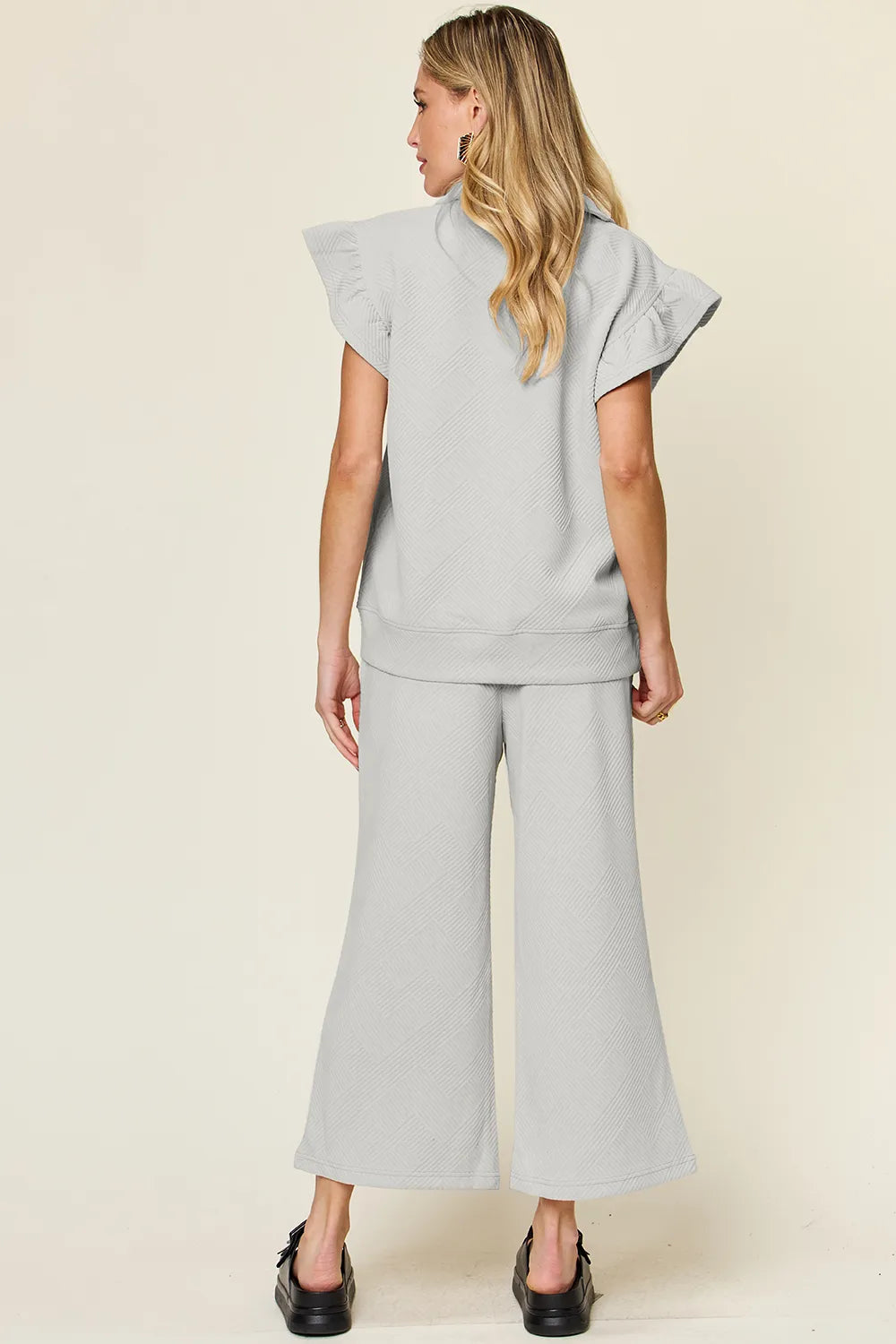 Cerulean blue double take texture ruffle short sleeve top with drawstring wide-leg pants set by Trendsi, casual stylish outfit.