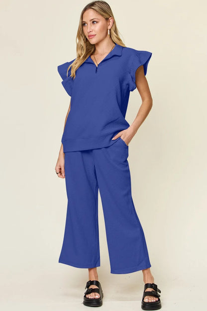 Cerulean double take texture ruffle short sleeve top and drawstring wide-leg pants set by Trendsi, stylish and comfortable outfit.