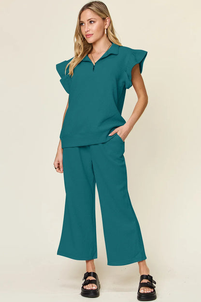 Cerulean double take textured ruffle short sleeve top with drawstring wide-leg pants set by Trendsi, styled for a casual look.