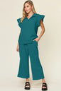 Cerulean double take textured ruffle short sleeve top with drawstring wide-leg pants set by Trendsi, styled for a casual look.