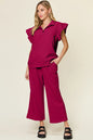 Trendsi double take texture ruffle short sleeve top with drawstring wide-leg pants set in cerulean color, casual stylish outfit.