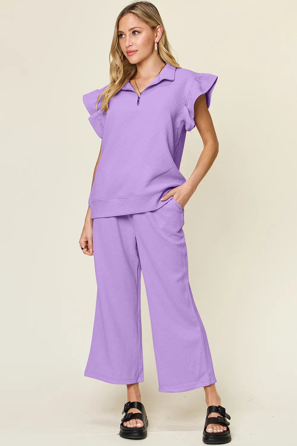 Cerulean blue double take texture ruffle short sleeve top with drawstring wide-leg pants set by Trendsi on a model.