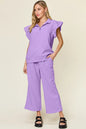 Cerulean blue double take texture ruffle short sleeve top with drawstring wide-leg pants set by Trendsi on a model.