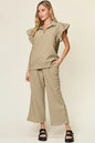 Trendsi cerulean double take texture ruffle short sleeve top with drawstring wide-leg pants set on a model.