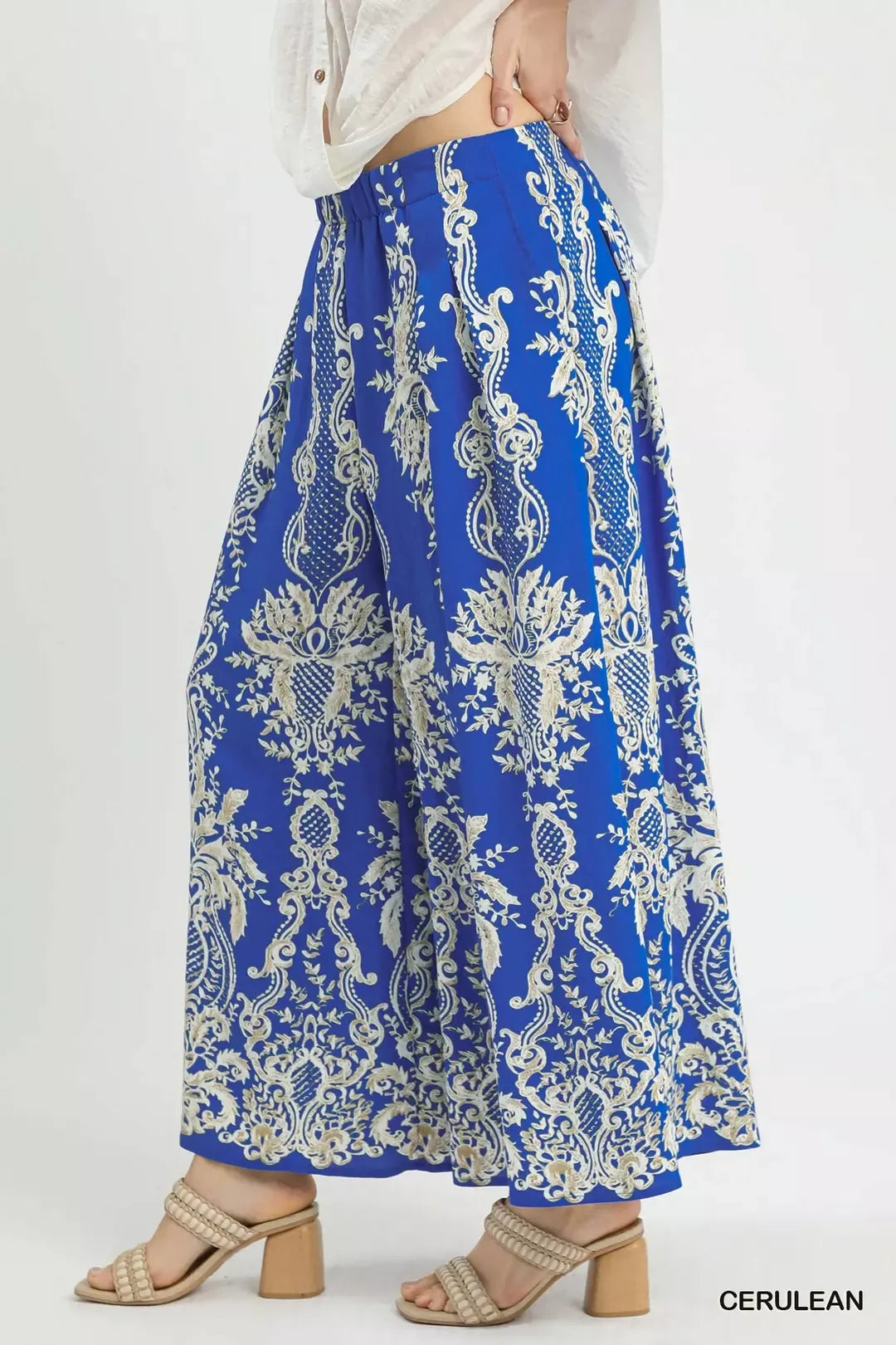Cerulean blue Umgee border print wide-leg pants with relaxed fit and comfortable waistband, perfect for casual wear.