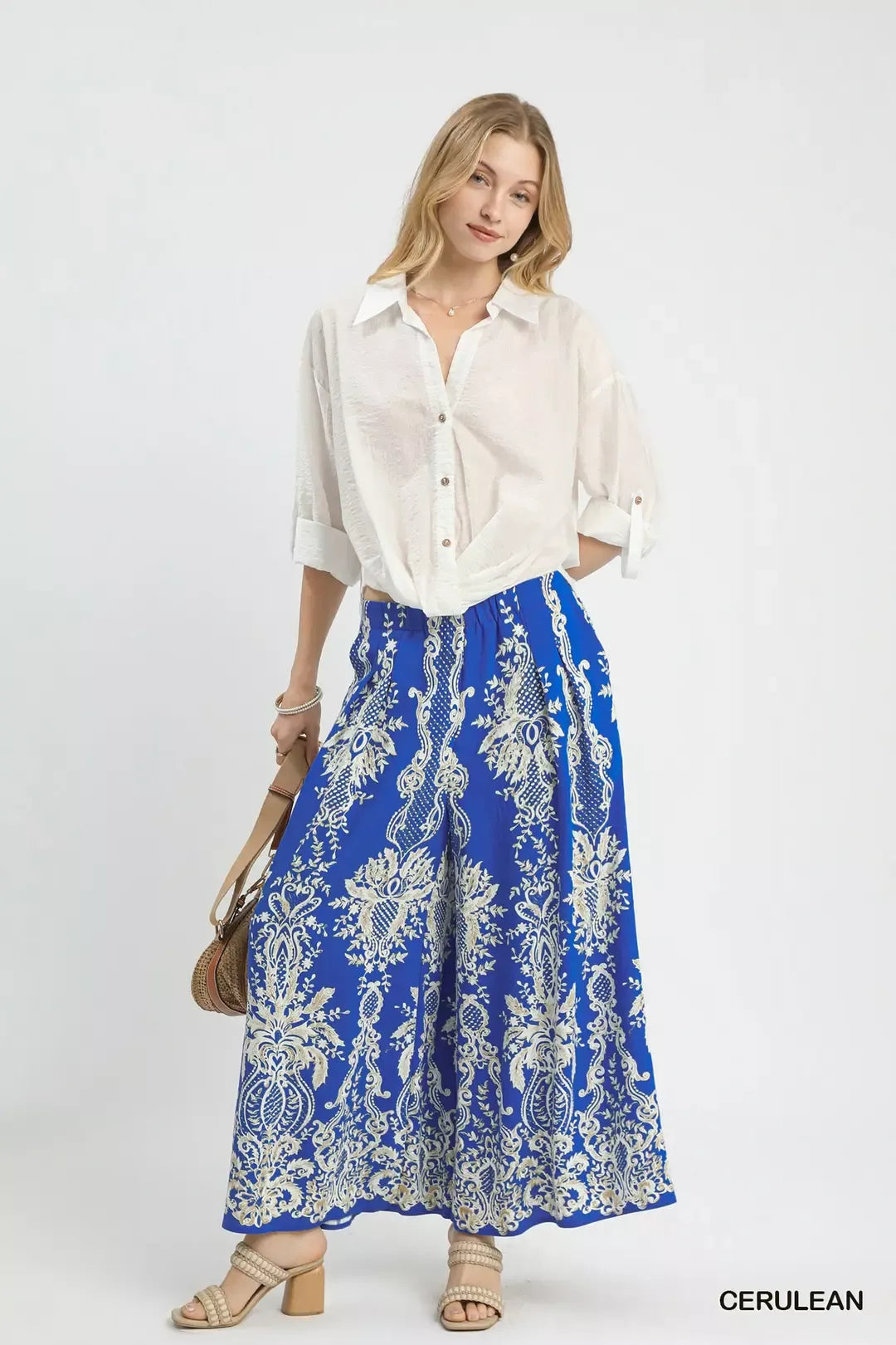 Cerulean blue Umgee border print wide-leg pants with relaxed fit and flowy fabric, perfect for casual and summer outfits.