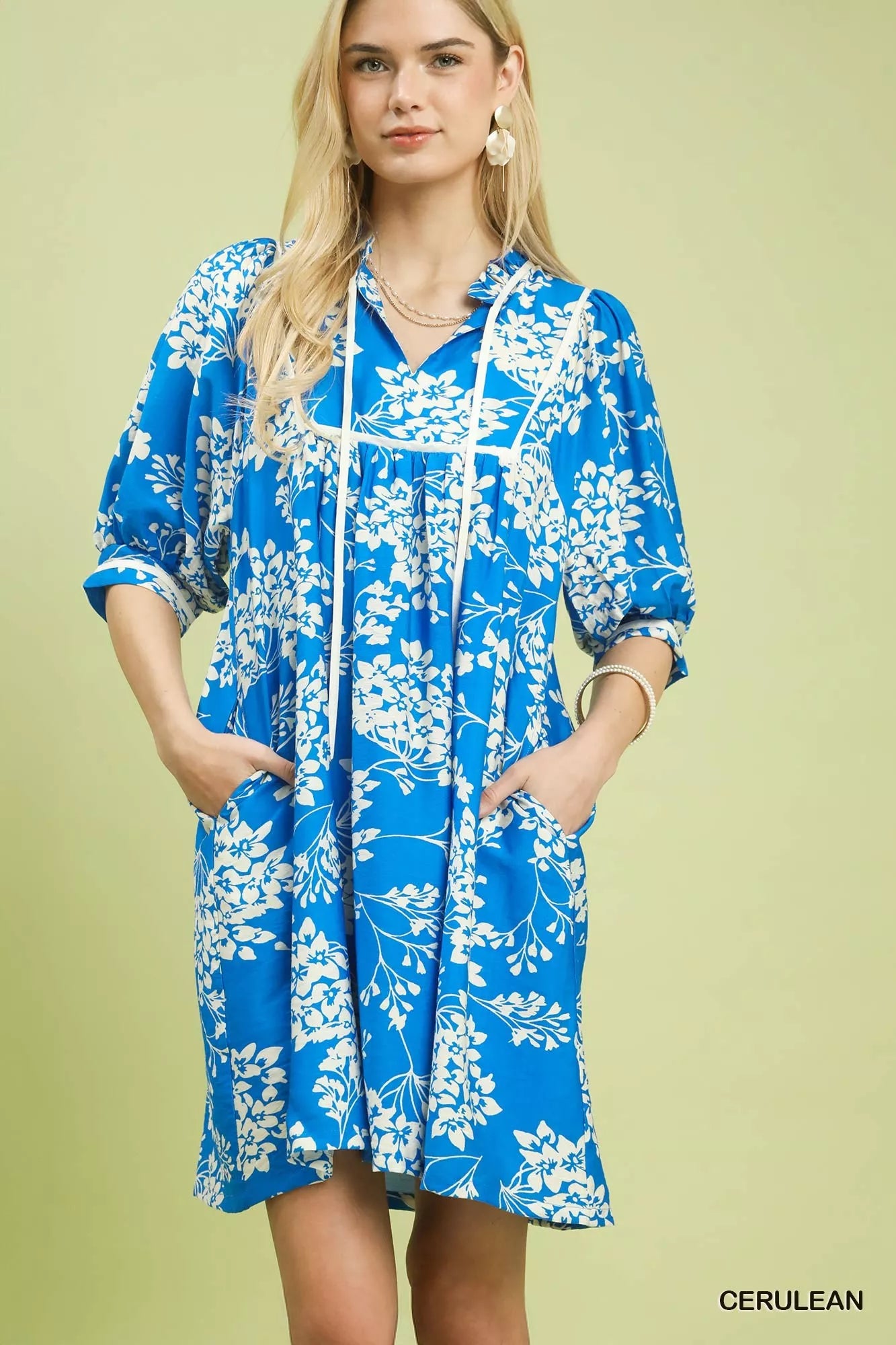 Cerulean blue Umgee floral babydoll dress with pockets, lightweight fabric, and relaxed fit, perfect for casual wear.