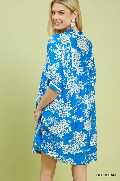 Cerulean floral babydoll dress by Umgee with pockets, featuring a relaxed fit and feminine design, perfect for casual wear.