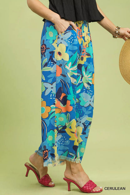 Cerulean Umgee floral print wide-leg pants with a relaxed fit, featuring a vibrant floral pattern and flowing silhouette.