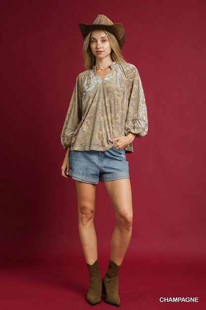 Umgee floral velvet blouse with balloon sleeves, in champagne color, featuring a stylish and elegant design.