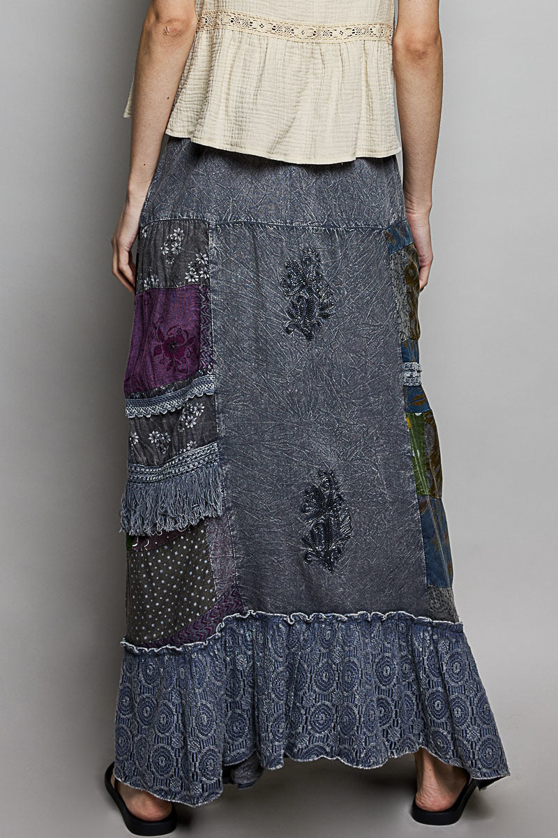 Charcoal multi-colored patchwork embroidered ruffled skirt by Trendsi, featuring intricate stitching and layered ruffle design.
