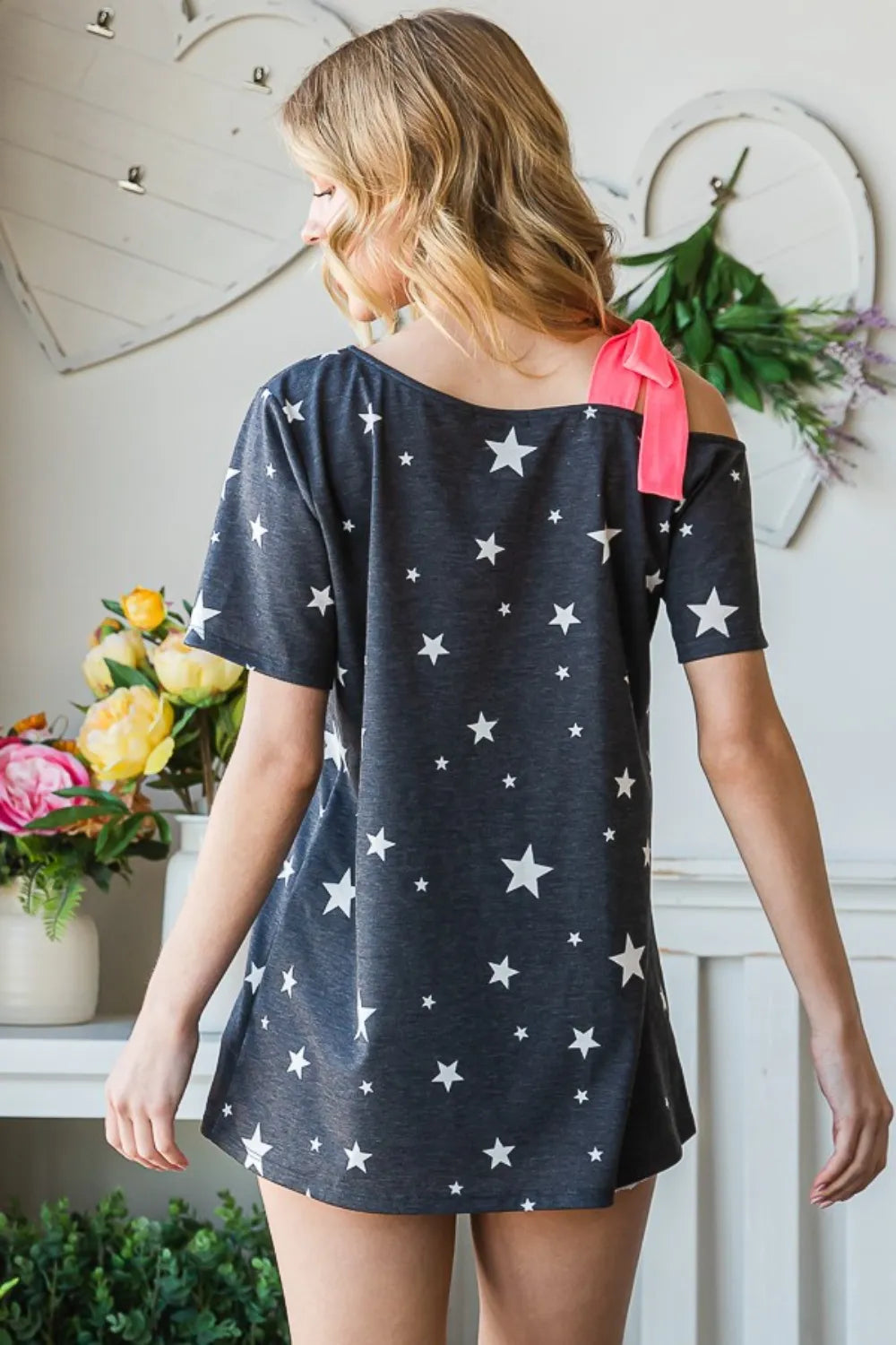 Charcoal Heimish short sleeve top with full-size star print and asymmetrical neckline, stylish and modern women's fashion.