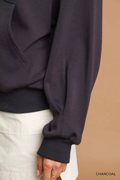 Charcoal Umgee zip-up fleece hooded jacket with front pockets and adjustable drawstrings, casual and cozy for layering.