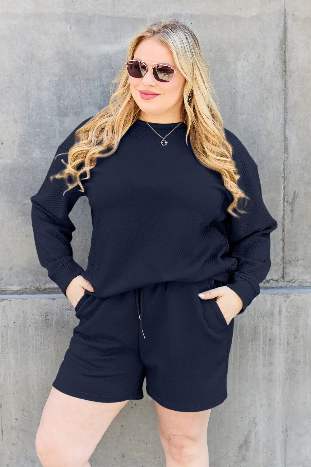 Trendsi chestnut-colored double take long sleeve top and drawstring shorts set, textured fabric, full size, casual loungewear ensemble.
